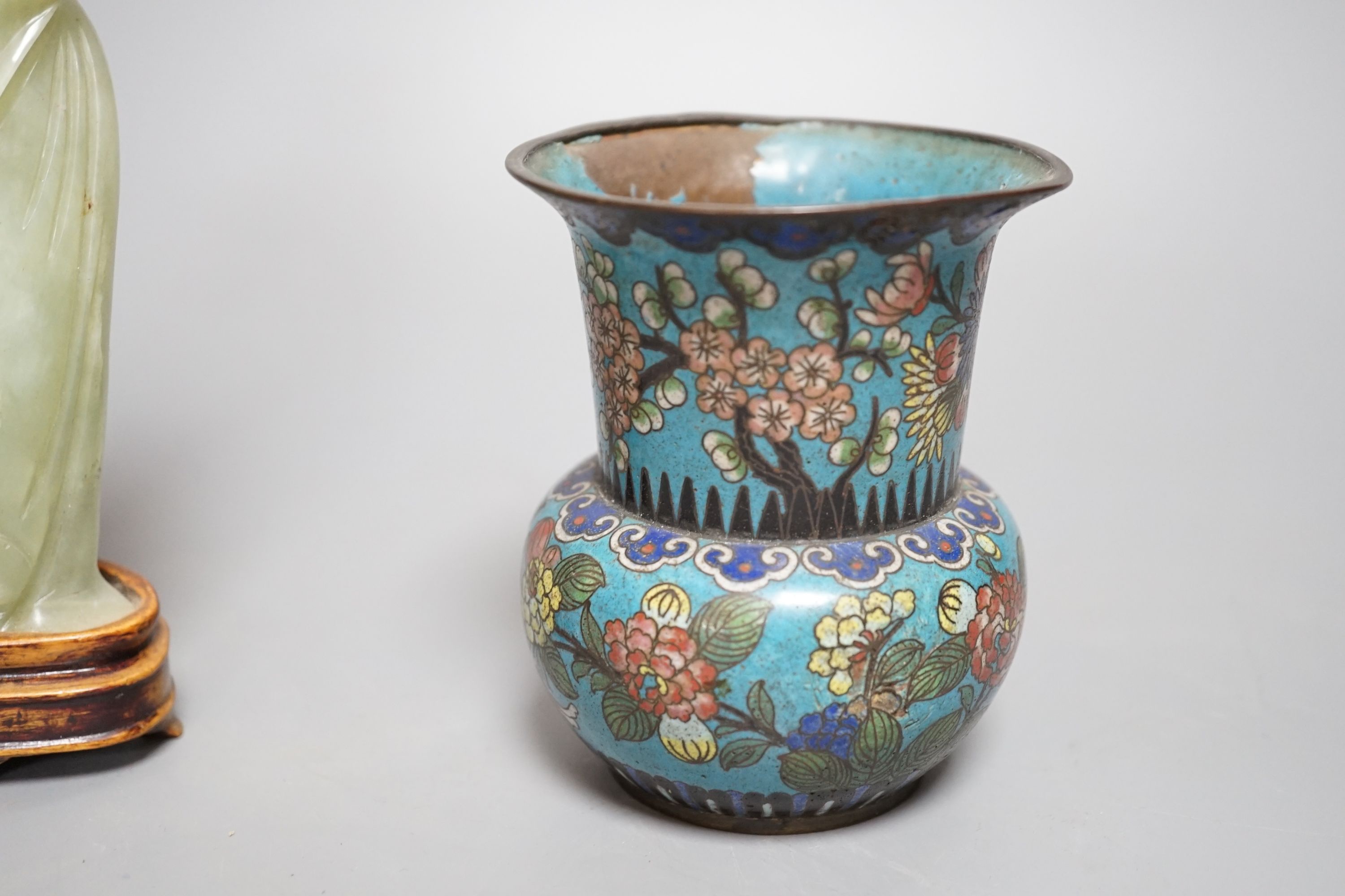 A small enamelled cloisonné vase, 10cm, together with a carved bowenite jade figure, on wood plinth and glazed ceramic brush pot